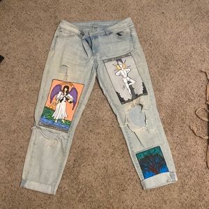 soho new york boyfriend jeans with tarot cards painted on the front